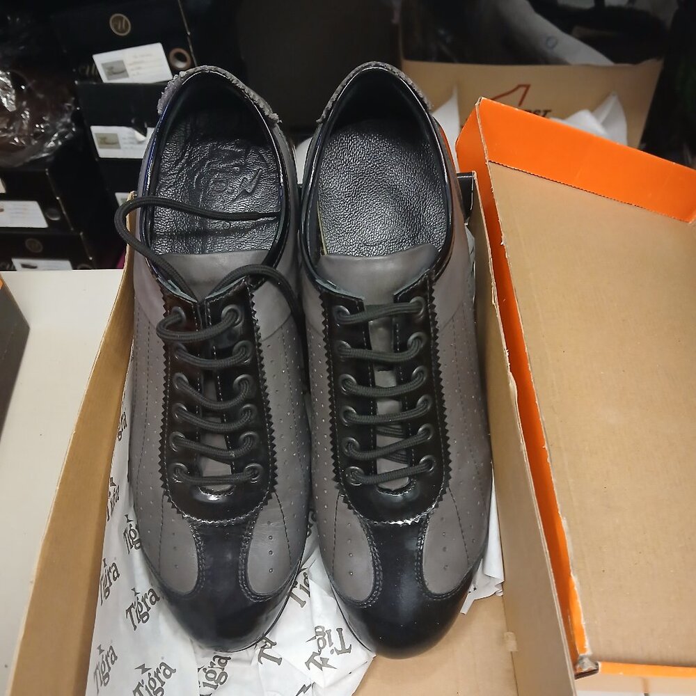 Interesting black and grey runners in grey and black leather . New and unworn.